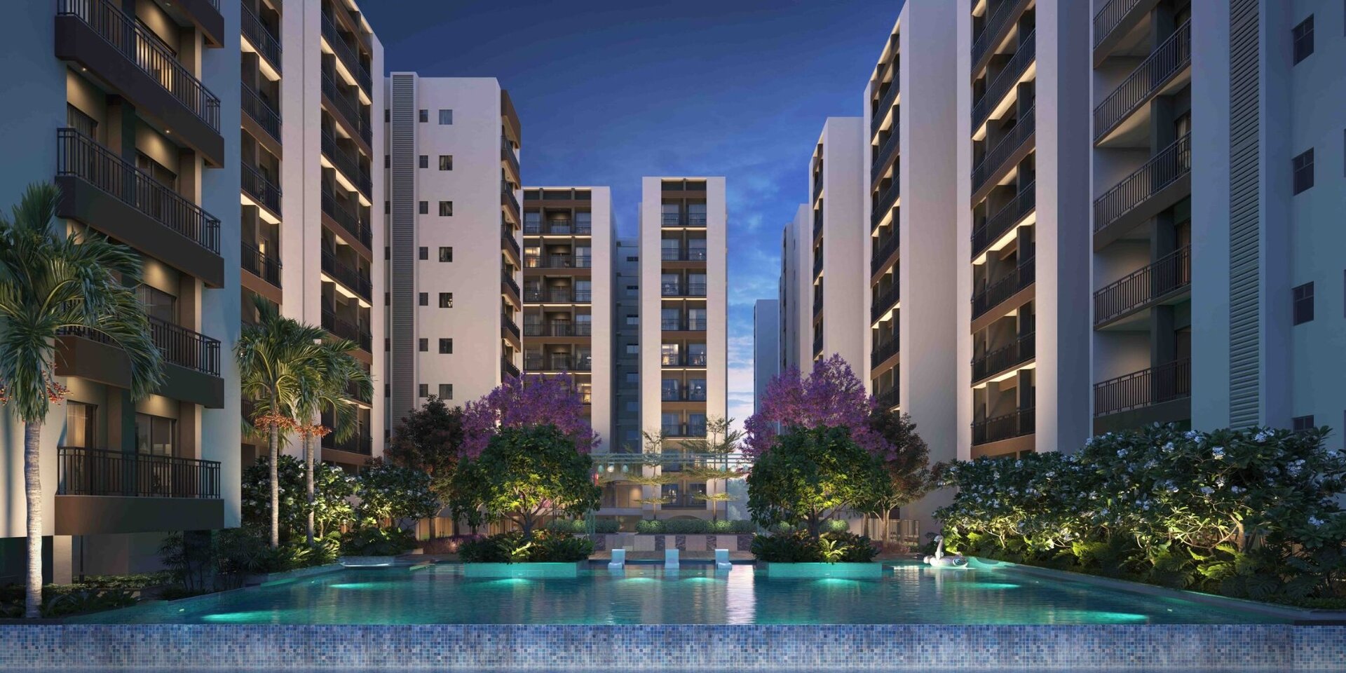 Srijan Spacia luxury apartments – swimming pool and towers at dusk, Madhyamgram Kolkata